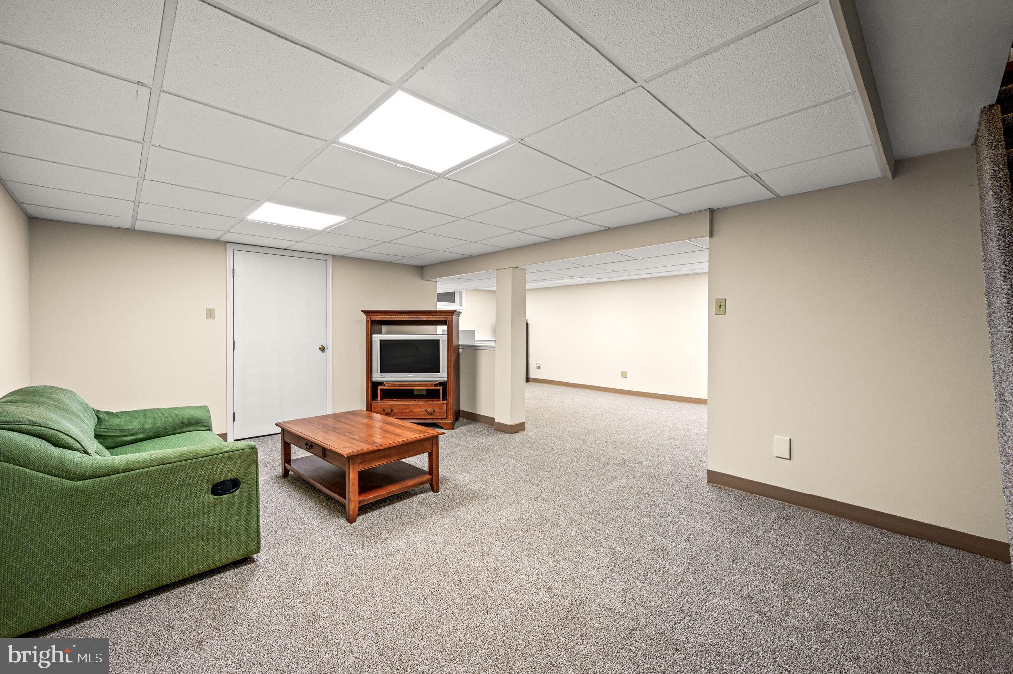 509 Lawrence Drive Springfield, PA 19064 - Photo 30 of 37 a living room with furniture and a window