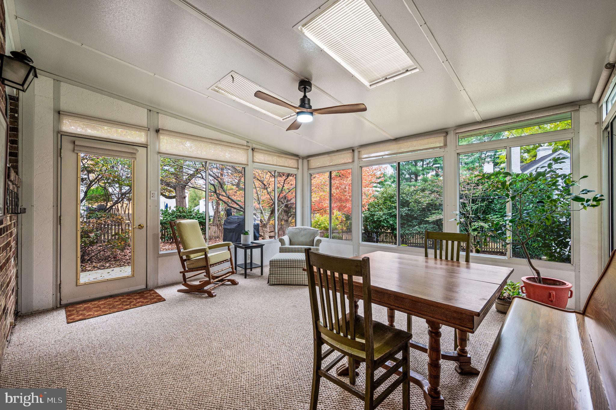 509 Lawrence Drive Springfield, PA 19064 - Photo 33 of 37 a dining room with furniture large windows and a chandelier