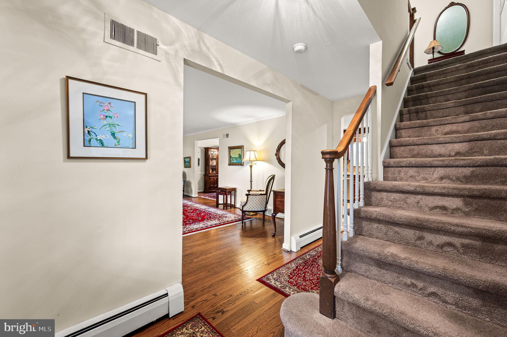 509 Lawrence Drive Springfield, PA 19064 - Photo 6 of 37 a view of entryway and hall with wooden floor
