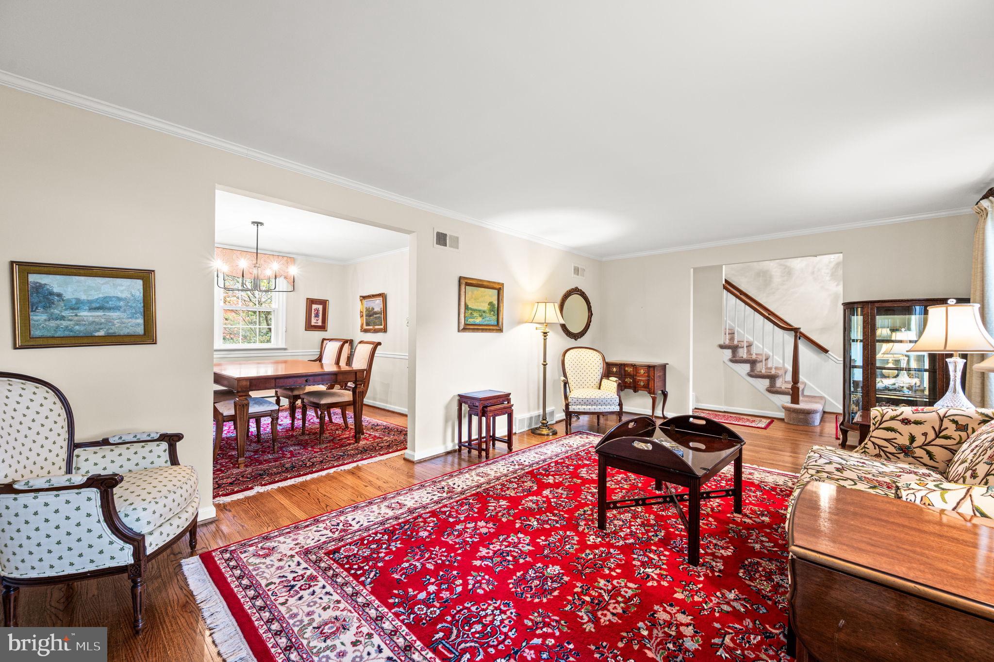 509 Lawrence Drive Springfield, PA 19064 - Photo 7 of 37 a living room with furniture a rug and a table