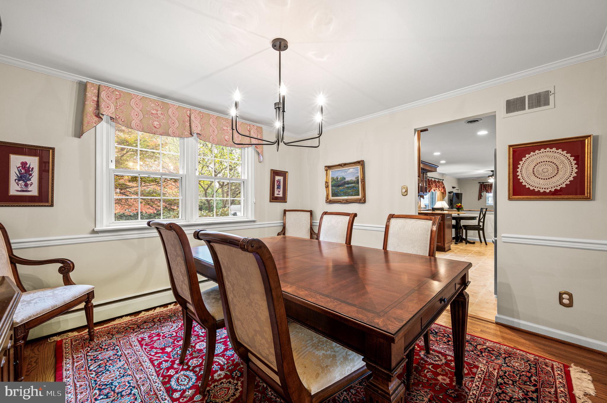 509 Lawrence Drive Springfield, PA 19064 - Photo 10 of 37 a view of a dining room with furniture window and wooden floor