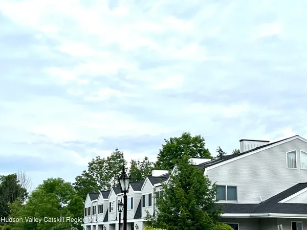 a view of a green field with lots of bushes