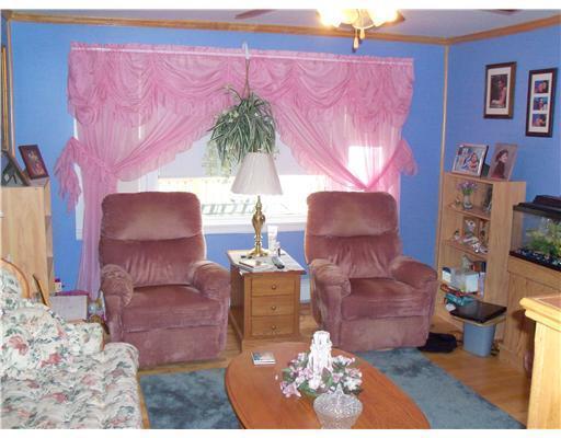 1041 Brewer Lake Road Orrington, ME 04474 - Photo 8 of 16 Living Room. Cozy Living Room