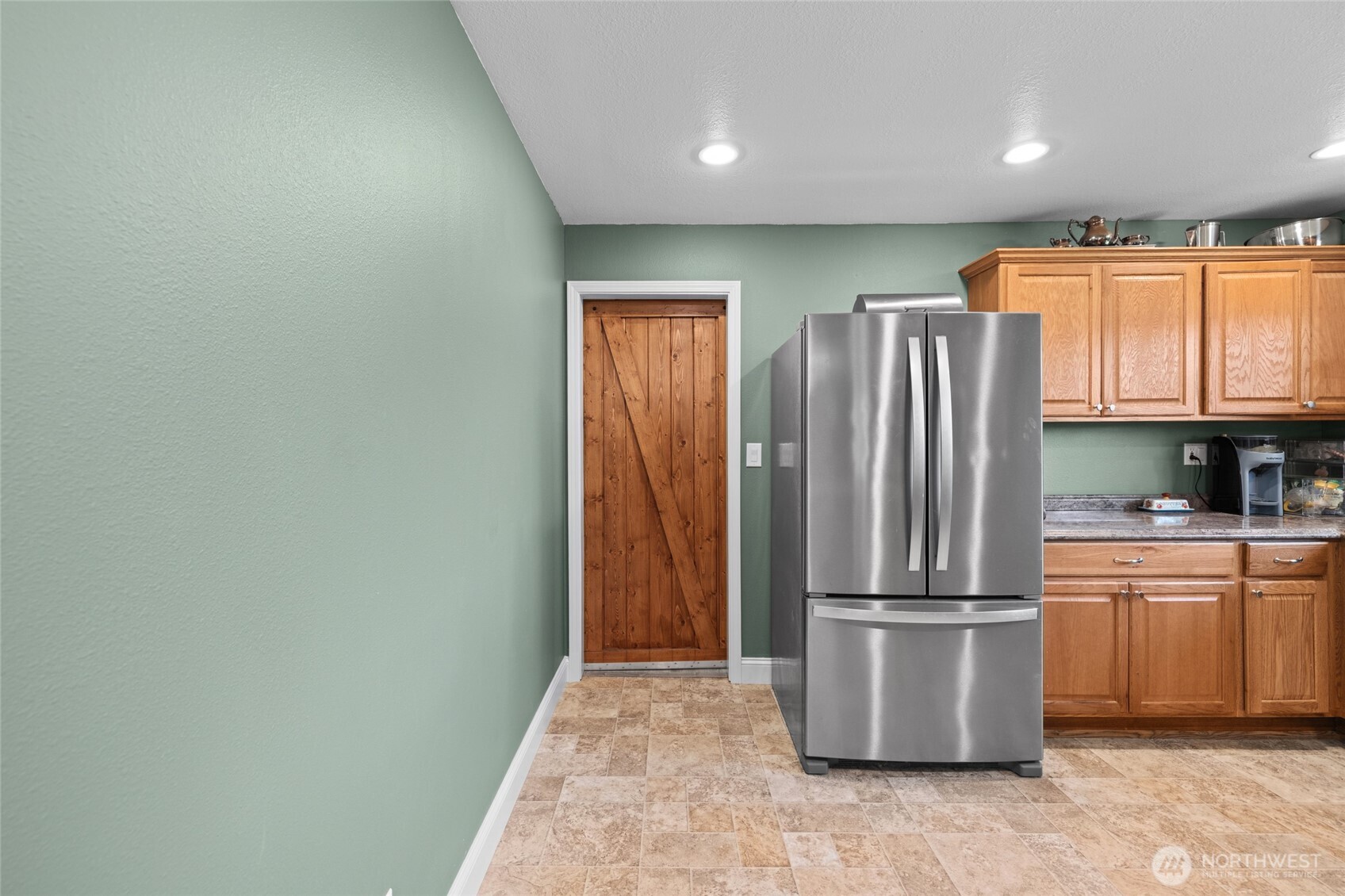 415 Sterling Street Sedro-Woolley, WA 98284 - Photo 21 of 38 a kitchen with a refrigerator and a sink