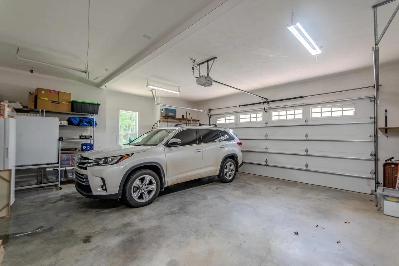 2134 Otis Plunk Road Bethel Springs, TN 38315 - Photo 25 of 35 a view of a garage and car parked