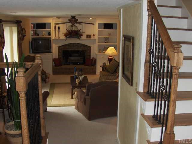 2717 Salisbury Raleigh, NC 27603 - Photo 1 of 12 a living room with furniture and a fireplace