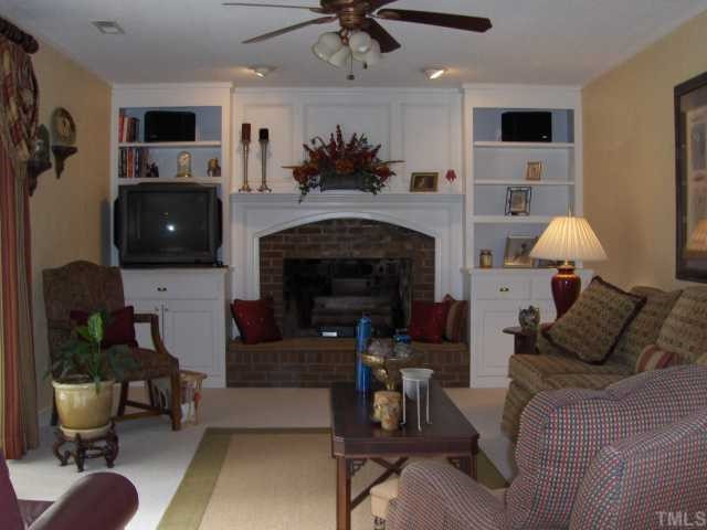 2717 Salisbury Raleigh, NC 27603 - Photo 11 of 12 a living room with furniture and a fireplace