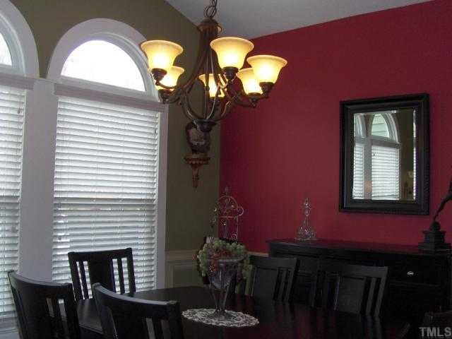 2717 Salisbury Raleigh, NC 27603 - Photo 4 of 12 a view of a livingroom with furniture and chandelier