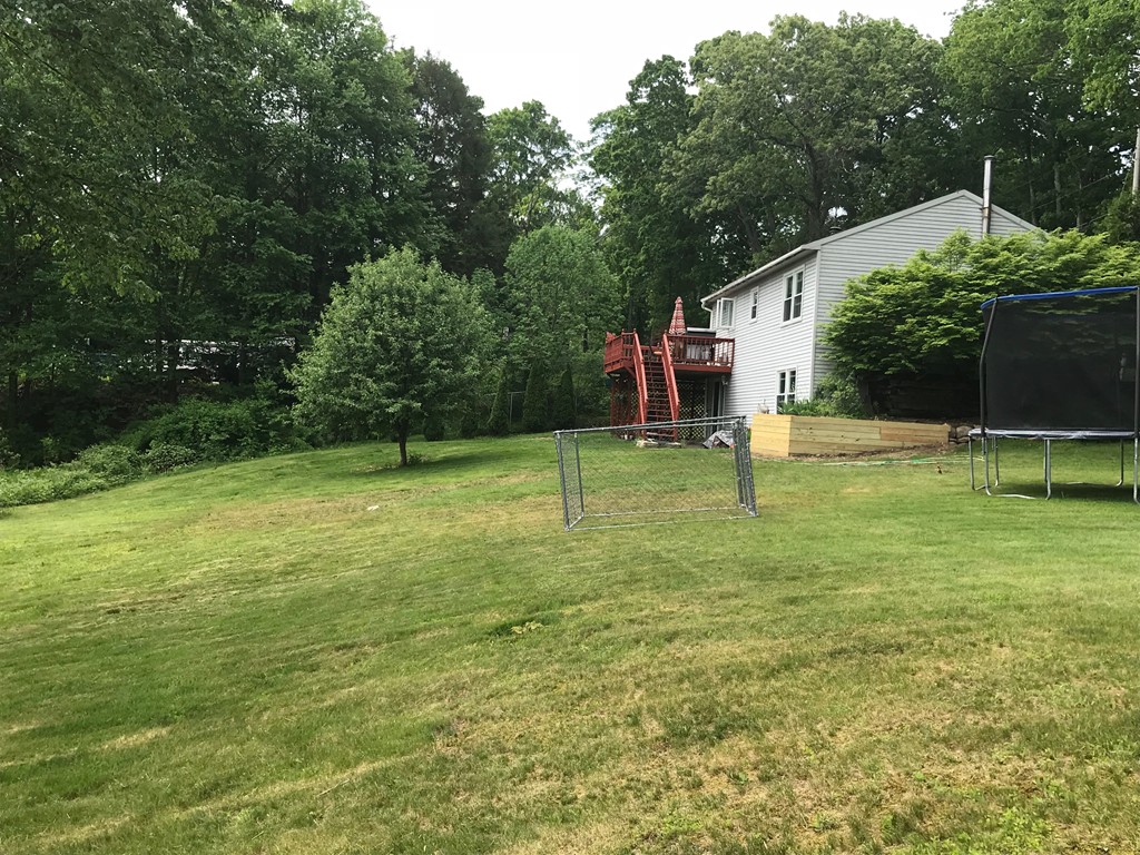 104 Fitzgerald Road Charlton, MA 01507 - Photo 13 of 14 a view of a house with a backyard