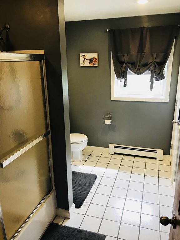 104 Fitzgerald Road Charlton, MA 01507 - Photo 6 of 14 a bathroom with a sink a toilet and a mirror