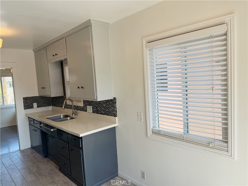 2030 East 3rd Street, Unit 5 Long Beach, CA 90814 - Photo 12 of 23 a bathroom with a sink vanity and a mirror