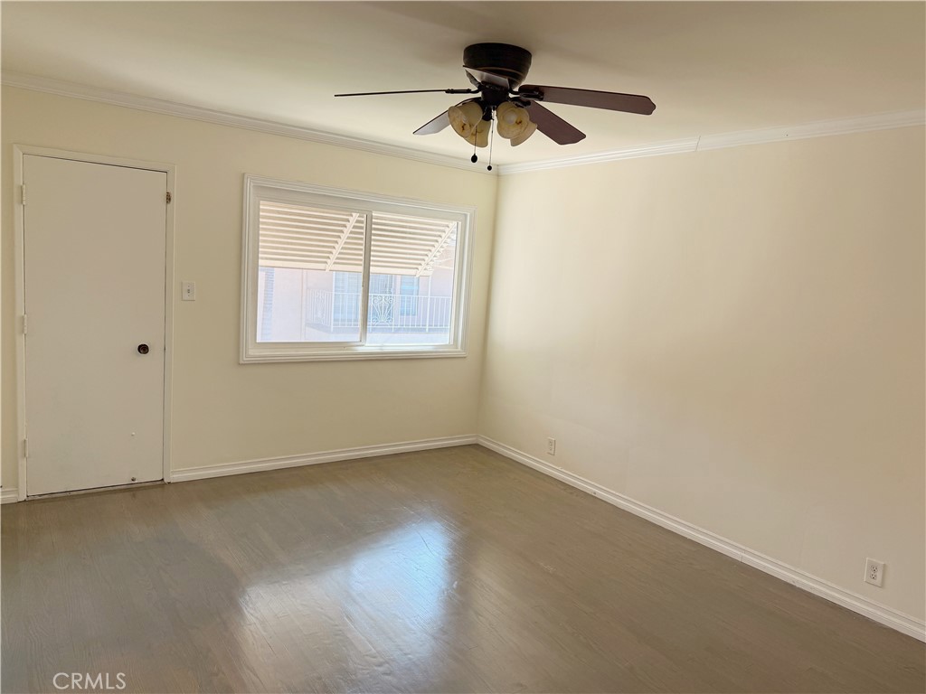2030 East 3rd Street, Unit 5 Long Beach, CA 90814 - Photo 22 of 23 an empty room with a window and a fan