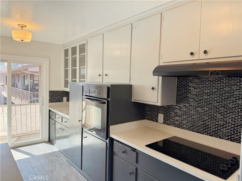 2030 East 3rd Street, Unit 5 Long Beach, CA 90814 - Photo 9 of 23 a kitchen with a sink and cabinets