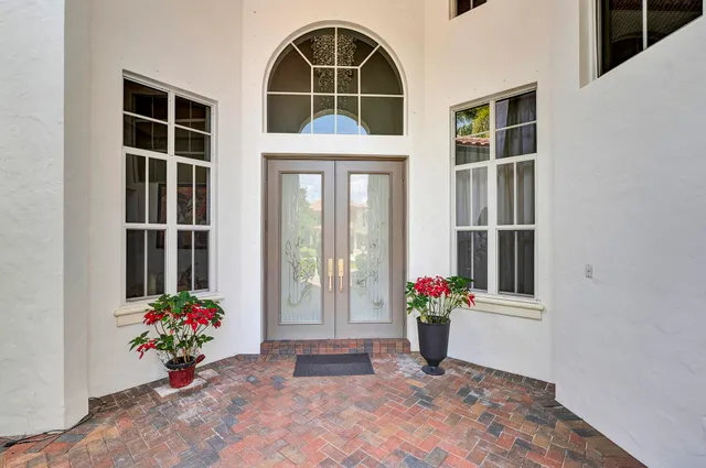a view of a living room and floor to ceiling window