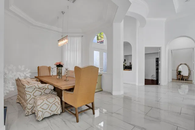 a view of a livingroom with furniture and a large window