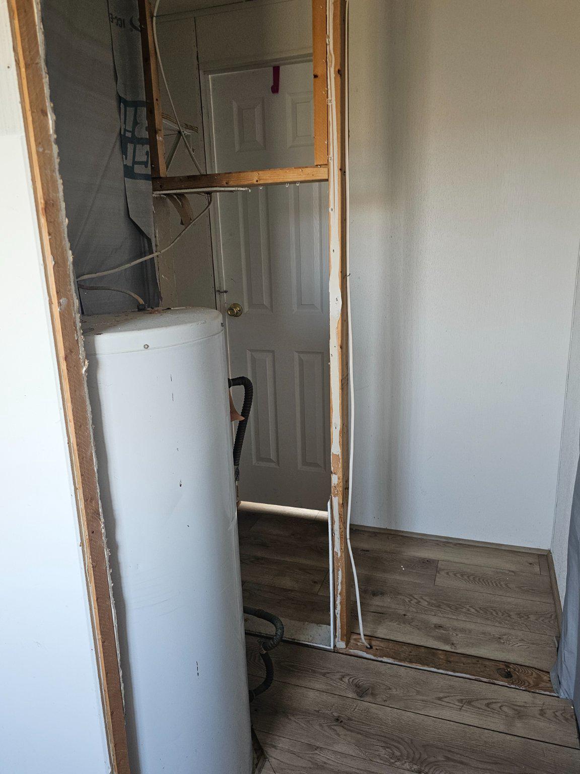 3401 Marsh Road Ewell, MD 21824 - Photo 15 of 26 Bedroom closet and water heater, needs finishing