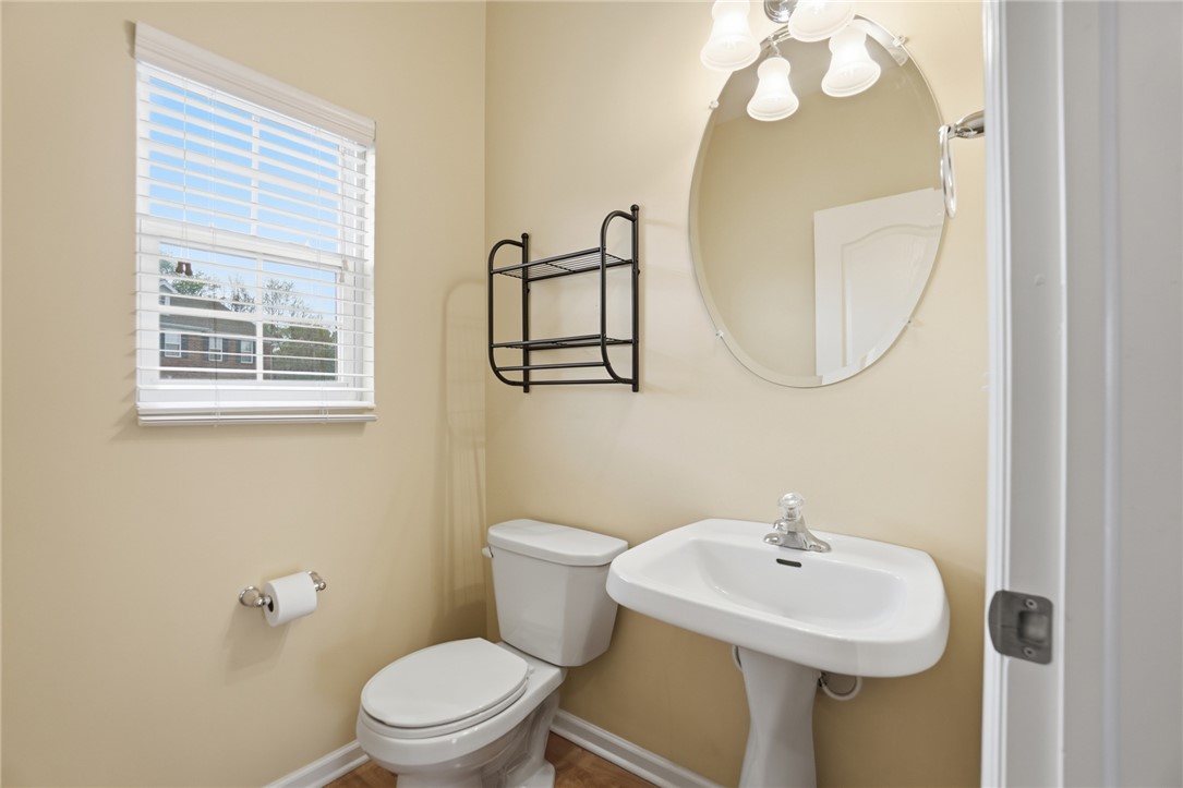 4324 Straight Arrow Road Dayton, OH 45430 - Photo 17 of 40 This bright bathroom features a pedestal sink and window, creating a refreshing atmosphere.