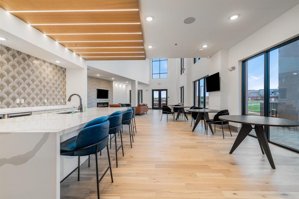 2700 Old Denton Road, Unit 3336 Carrollton, TX 75007 - Photo 29 of 29 a group of people sitting at tables in a room