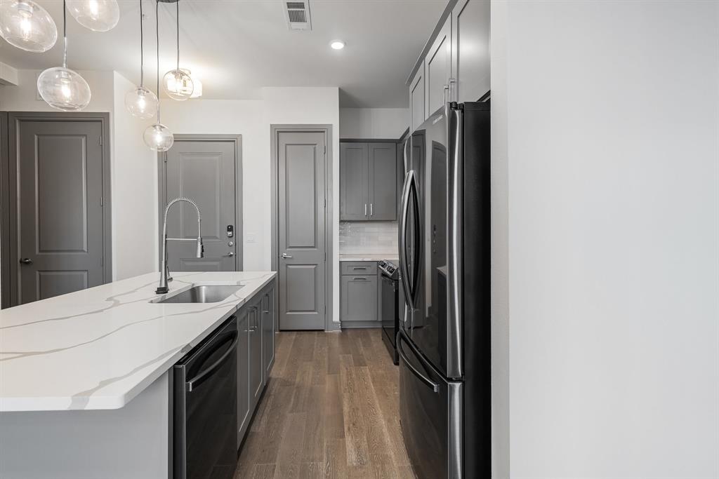 2700 Old Denton Road, Unit 3336 Carrollton, TX 75007 - Photo 6 of 29 a bathroom with a sink a shower a mirror and a shower