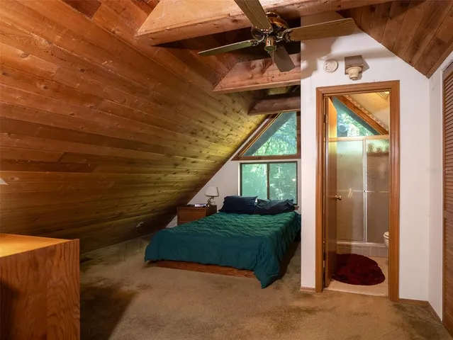 a bathroom with a toilet and shower