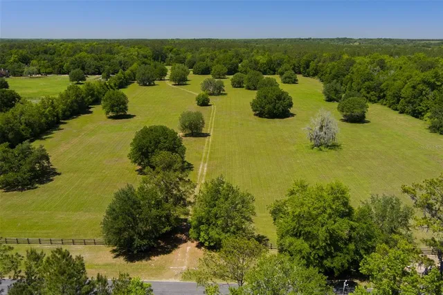 a view of a lake with a yard