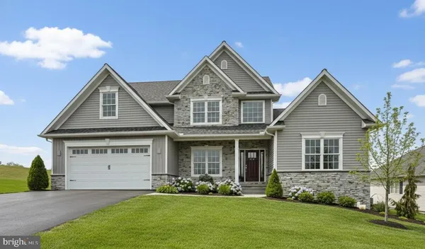 front view of a house with a yard