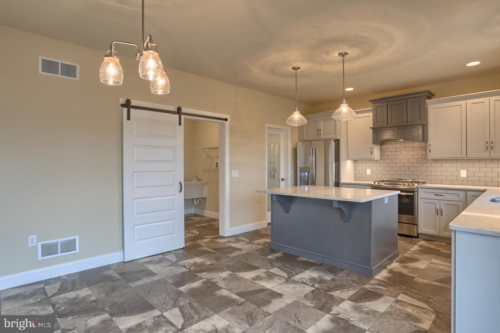 23 Rolling Meadow Road Lebanon, PA 17046 - Photo 17 of 44 a large kitchen with cabinets and wooden floor