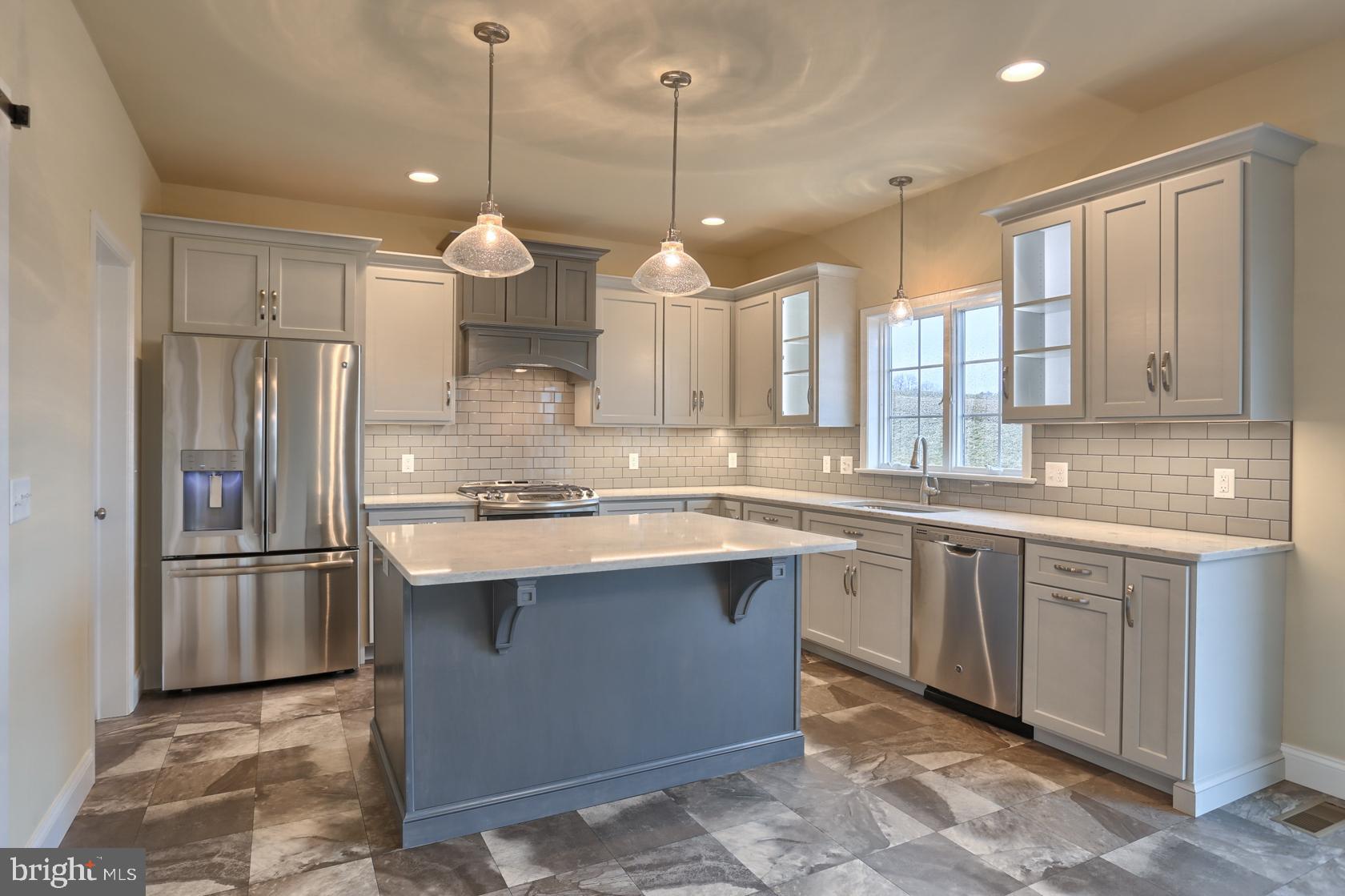 23 Rolling Meadow Road Lebanon, PA 17046 - Photo 18 of 44 a kitchen with stainless steel appliances granite countertop a sink refrigerator and cabinets
