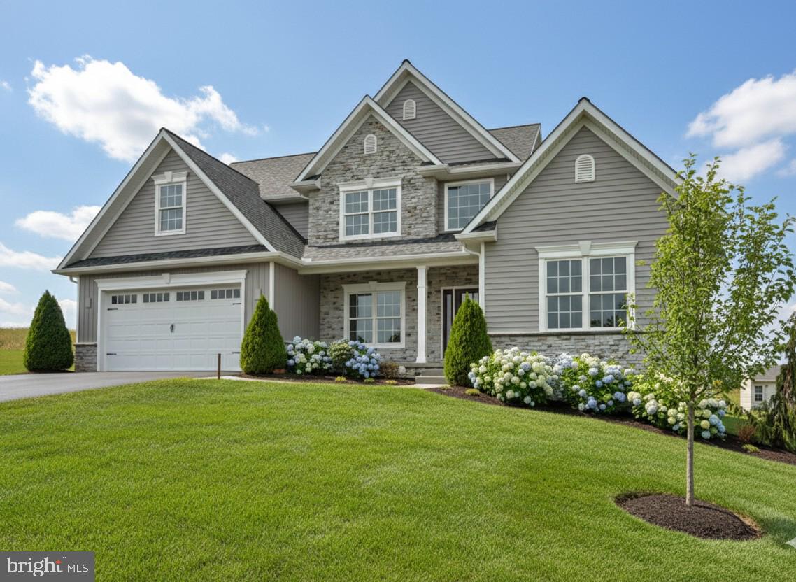 23 Rolling Meadow Road Lebanon, PA 17046 - Photo 2 of 44 a front view of a house with a yard and garage
