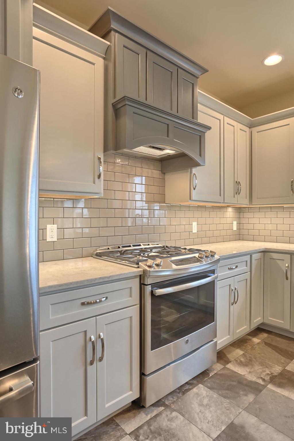 23 Rolling Meadow Road Lebanon, PA 17046 - Photo 21 of 44 a kitchen with stainless steel appliances granite countertop a sink a stove and a refrigerator