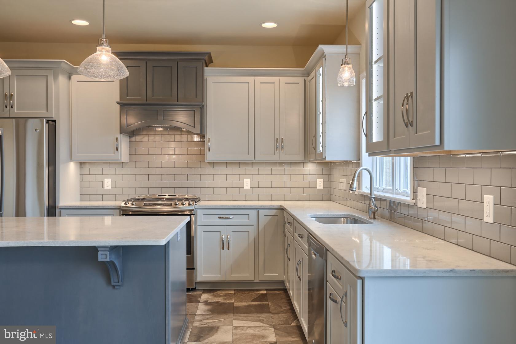 23 Rolling Meadow Road Lebanon, PA 17046 - Photo 23 of 44 a kitchen with a sink stove and cabinets