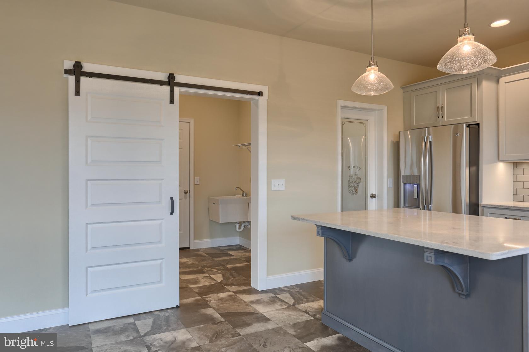 23 Rolling Meadow Road Lebanon, PA 17046 - Photo 27 of 44 a view of a refrigerator in kitchen and an empty room