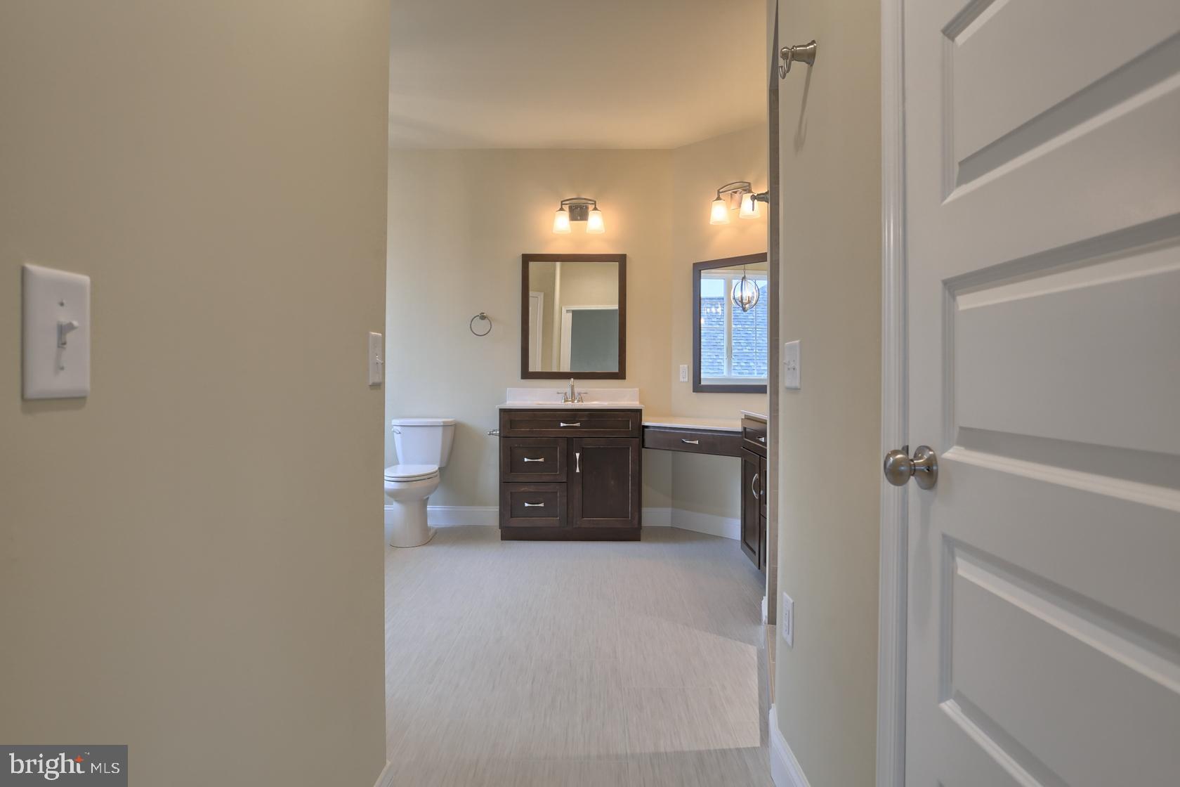 23 Rolling Meadow Road Lebanon, PA 17046 - Photo 30 of 44 a spacious bathroom with a granite countertop sink and a mirror