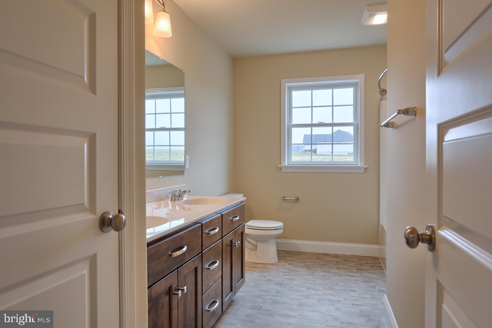 23 Rolling Meadow Road Lebanon, PA 17046 - Photo 38 of 44 a bathroom with a granite countertop sink toilet and shower