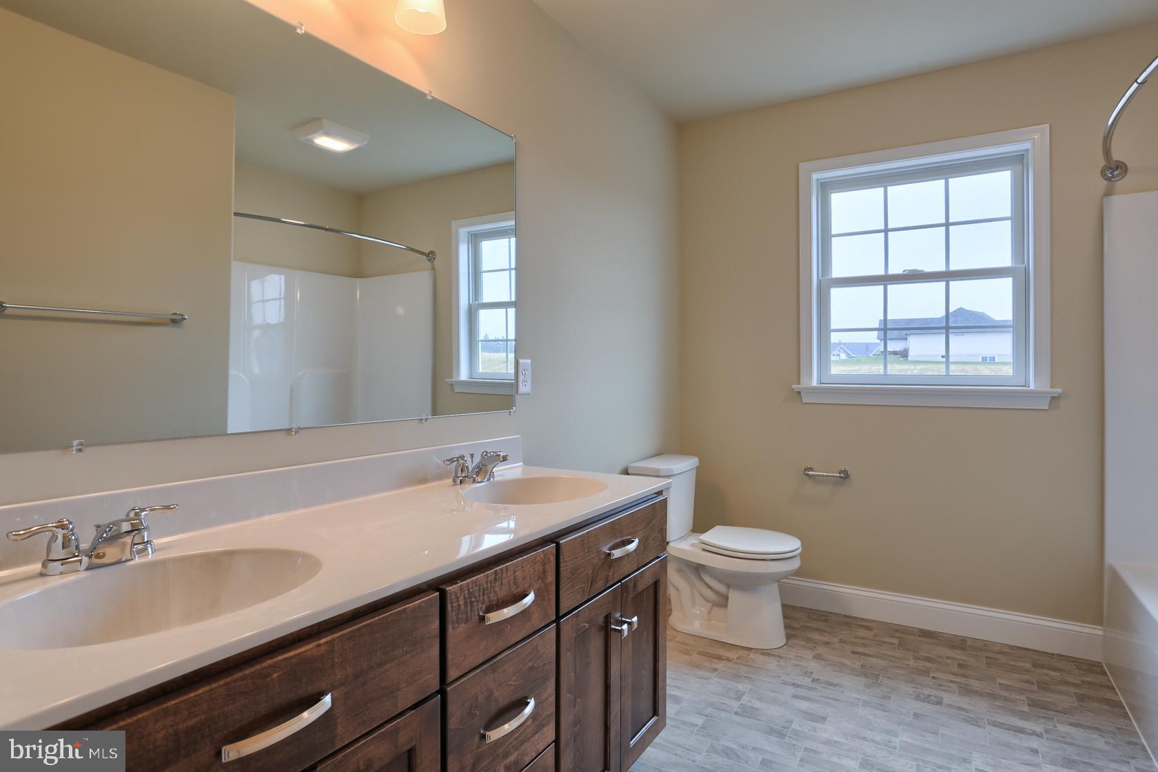 23 Rolling Meadow Road Lebanon, PA 17046 - Photo 39 of 44 a bathroom with a sink a toilet and a mirror