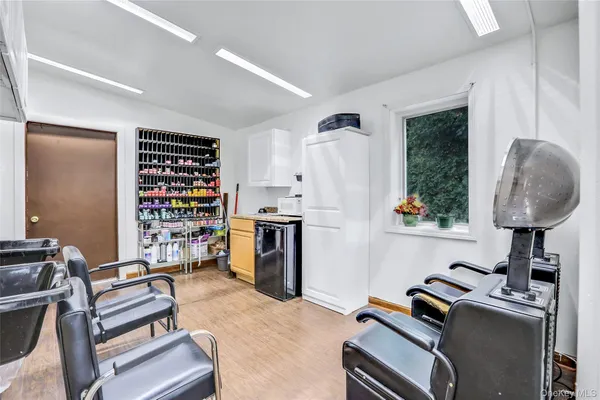 a room with furniture a rug and a window