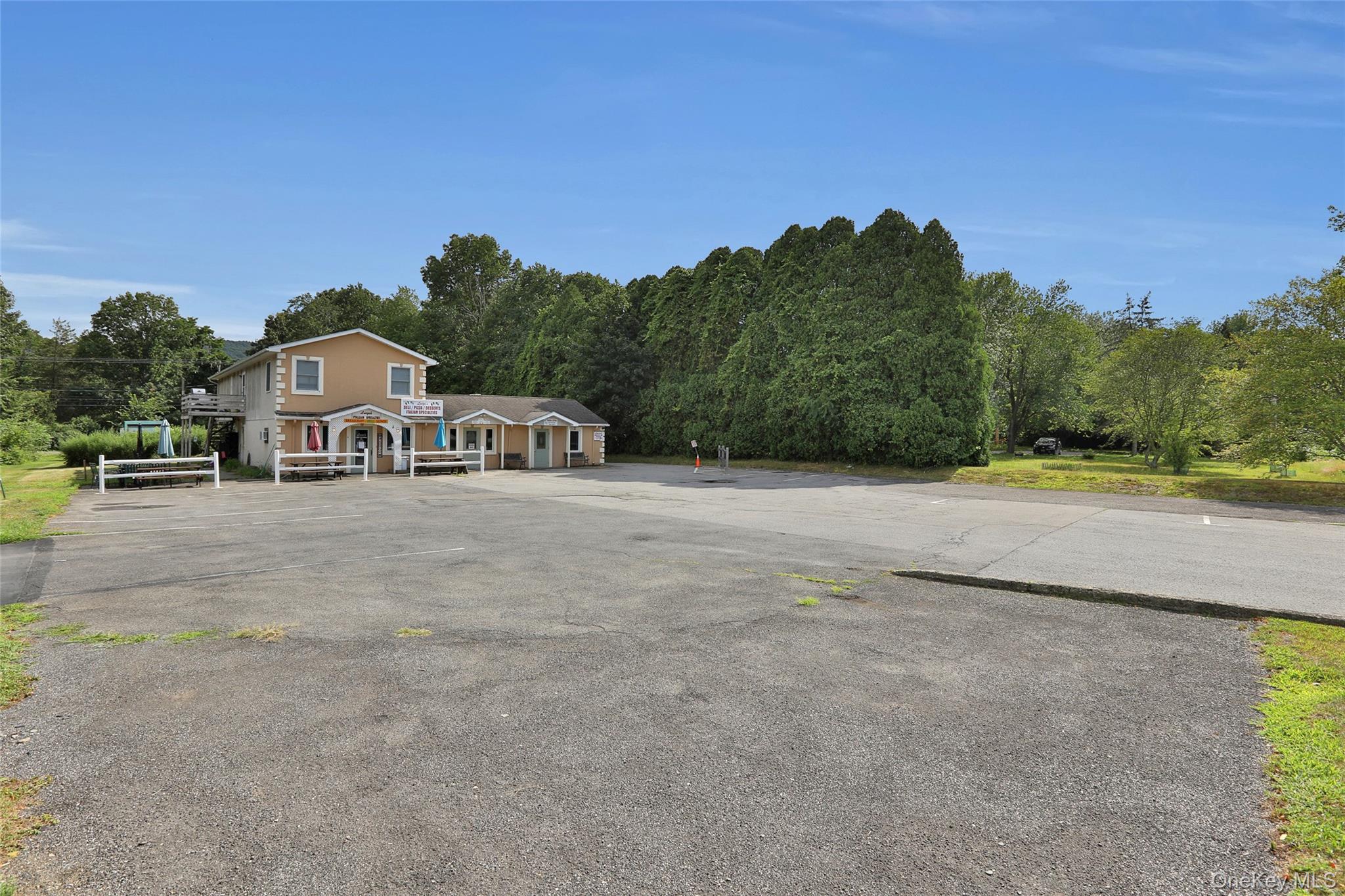 199 Highway 299, Unit 103 Highland, NY 12528 - Photo 7 of 9 a front view of a house with a yard