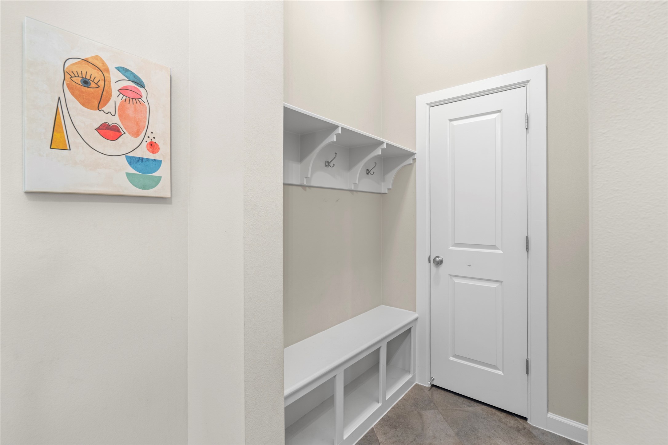 143 Castlegate Lane Houston, TX 77065 - Photo 25 of 33 Mud room with storage closet, giving access to the garage (not shown here. Upgraded motion-activated light for safety and convenience.