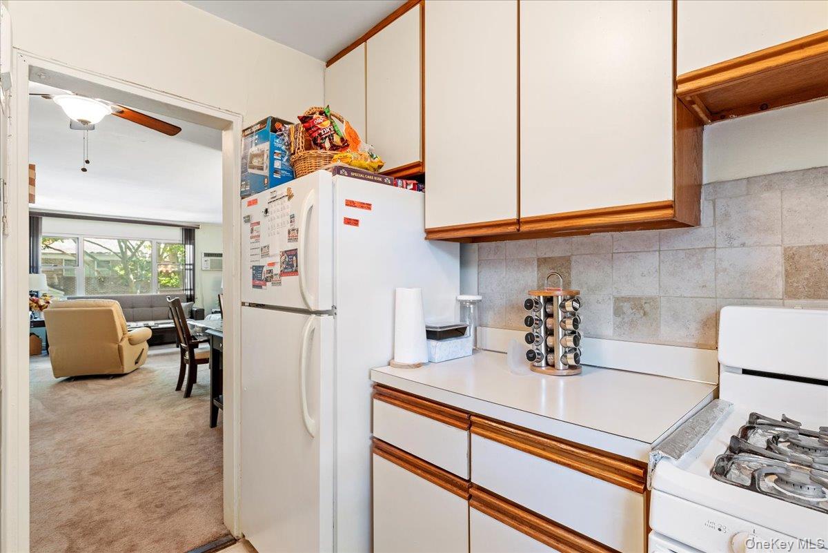 87-44 Marengo Street, Unit 2A Queens, NY 11423 - Photo 11 of 23 a kitchen with stainless steel appliances granite countertop a refrigerator and a sink