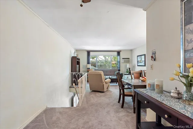 a dining room with furniture and chandelier