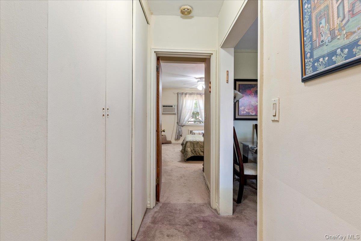 87-44 Marengo Street, Unit 2A Queens, NY 11423 - Photo 16 of 23 a view of a hallway with wooden shelves