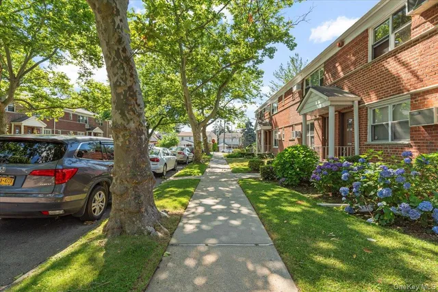 a view of multiple houses with yard