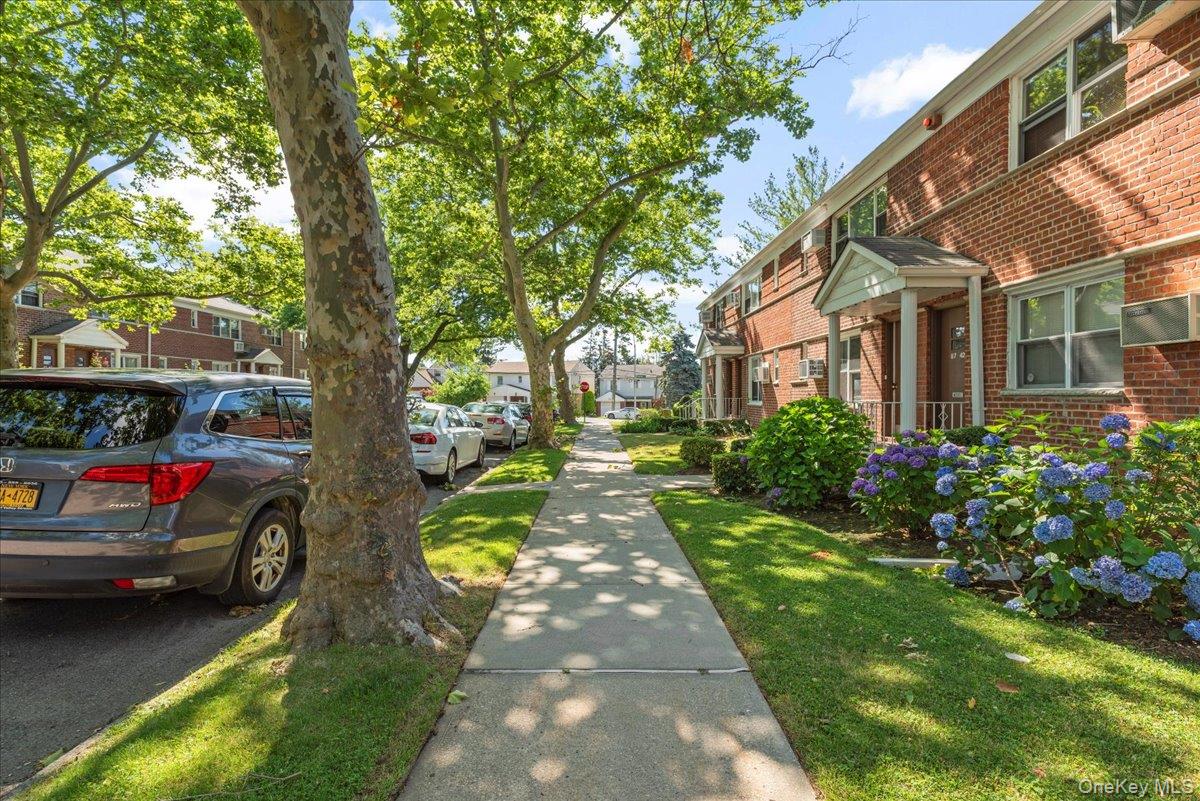 87-44 Marengo Street, Unit 2A Queens, NY 11423 - Photo 3 of 23 a view of multiple houses with yard