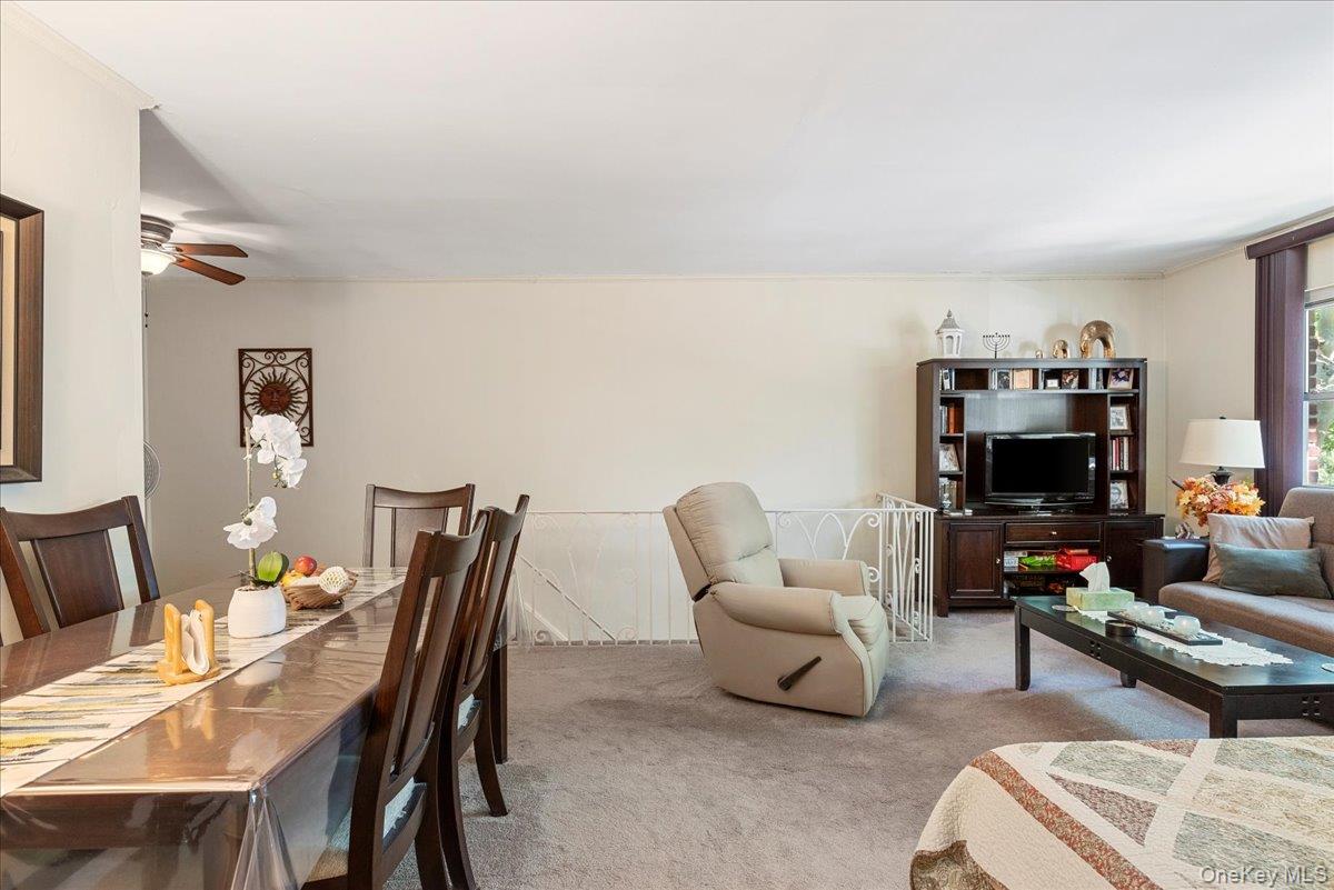 87-44 Marengo Street, Unit 2A Queens, NY 11423 - Photo 6 of 23 a living room with furniture a flat screen tv and a window