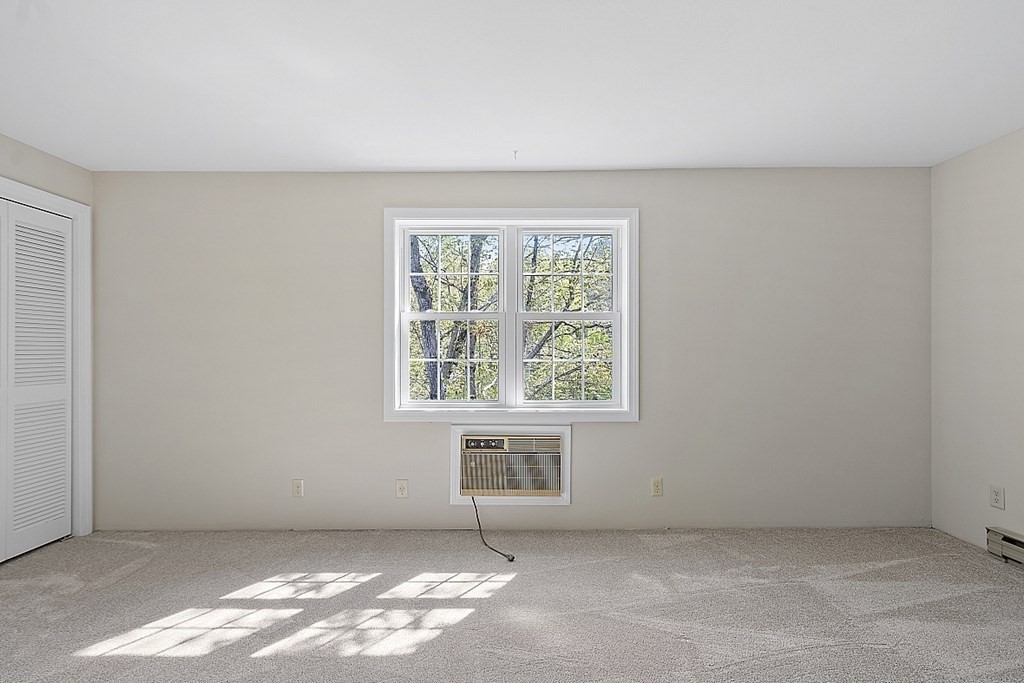 27 Ernest Avenue, Unit 24 Exeter, NH 03833 - Photo 19 of 38 an empty room with windows