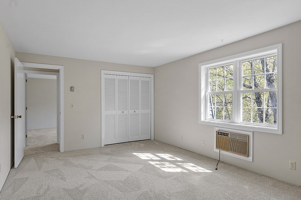 27 Ernest Avenue, Unit 24 Exeter, NH 03833 - Photo 20 of 38 a view of an empty room with a window