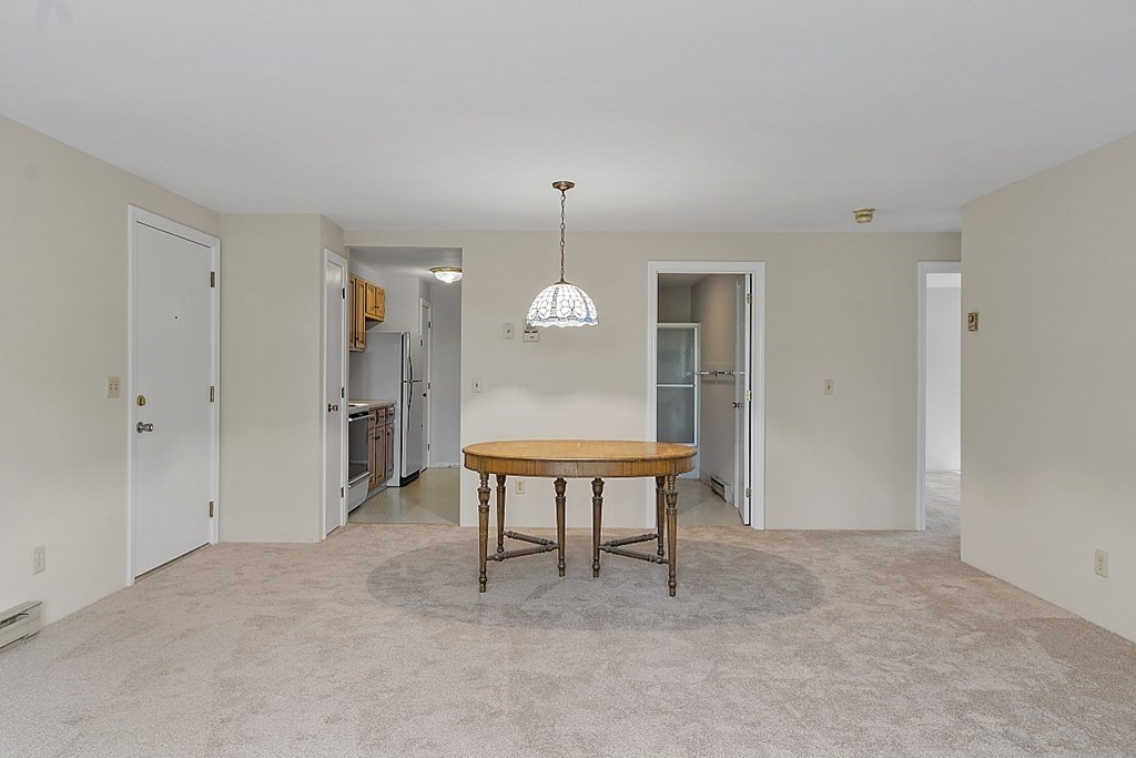 27 Ernest Avenue, Unit 24 Exeter, NH 03833 - Photo 2 of 38 a view of a livingroom with furniture window and wooden floor