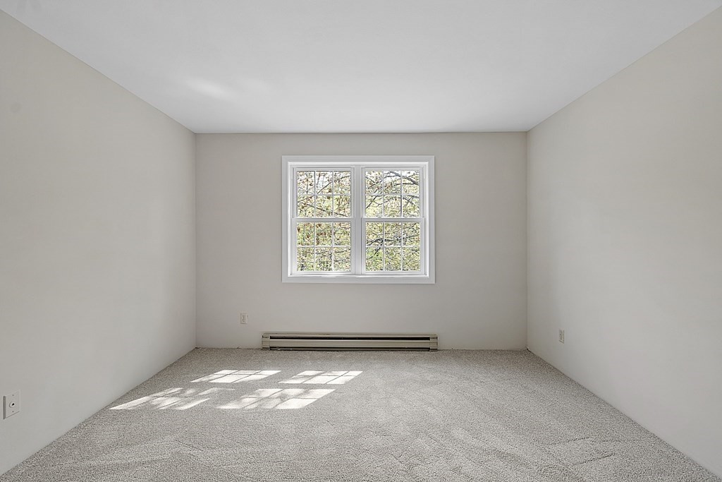 27 Ernest Avenue, Unit 24 Exeter, NH 03833 - Photo 22 of 38 an empty room with a window