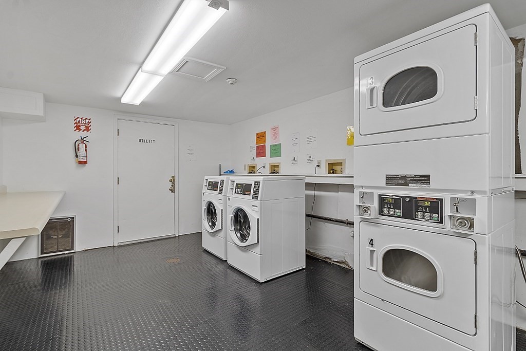 27 Ernest Avenue, Unit 24 Exeter, NH 03833 - Photo 26 of 38 a utility room with dryer and washer
