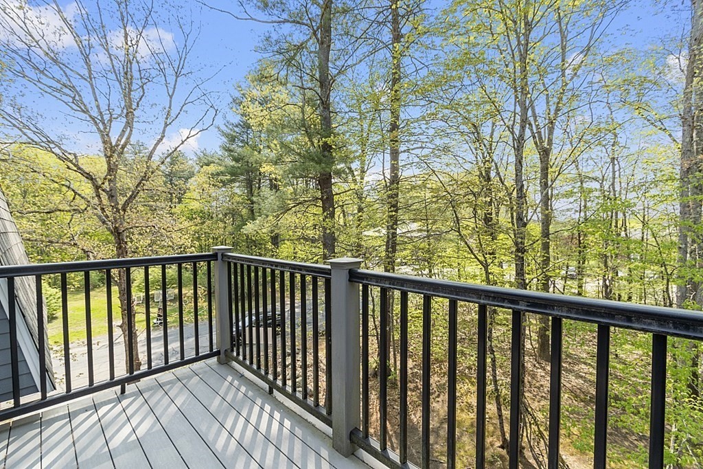 27 Ernest Avenue, Unit 24 Exeter, NH 03833 - Photo 33 of 38 a view of a balcony with wooden fence and floor
